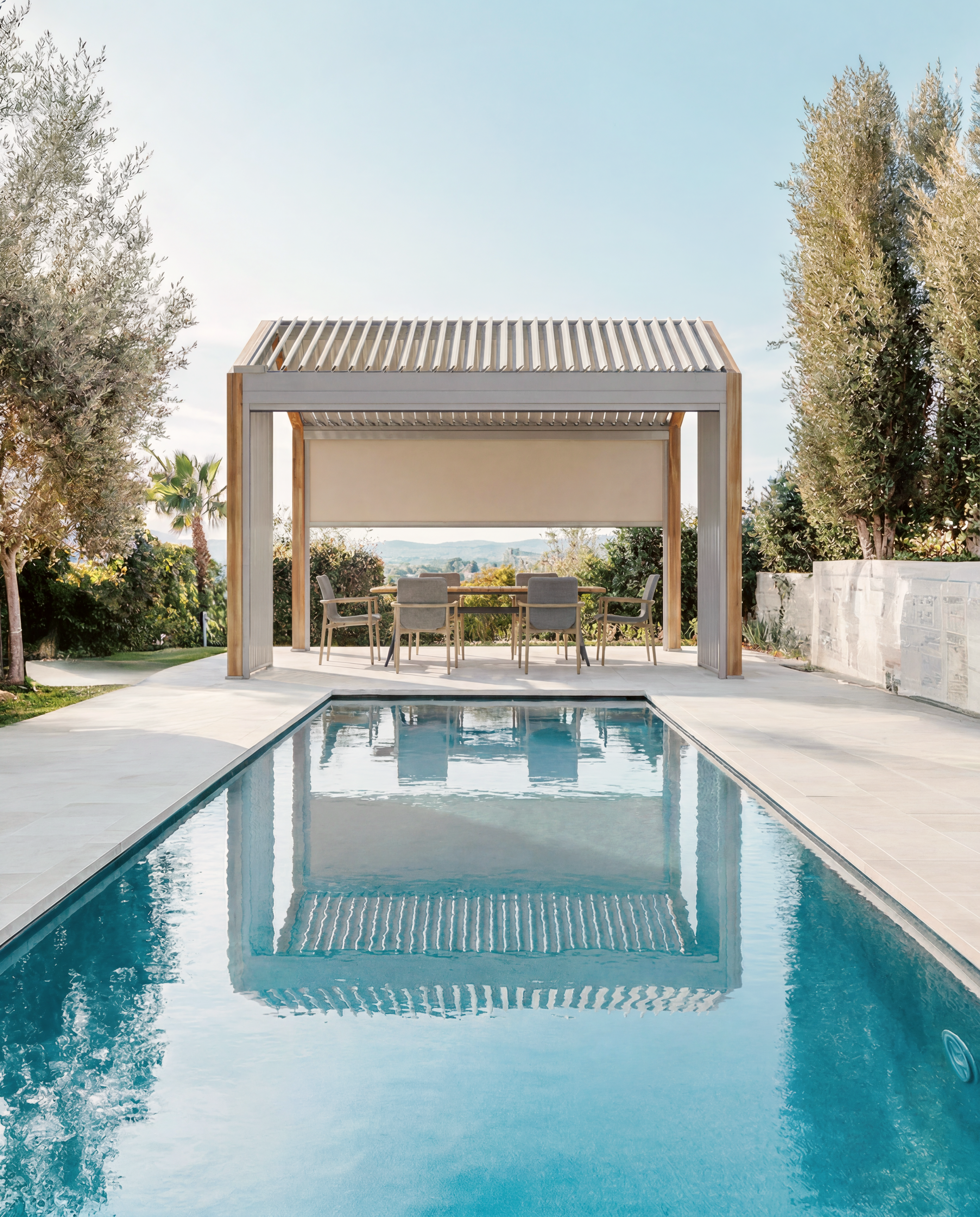 Dining furniture and pergola coordinated as a complete outdoor patio package