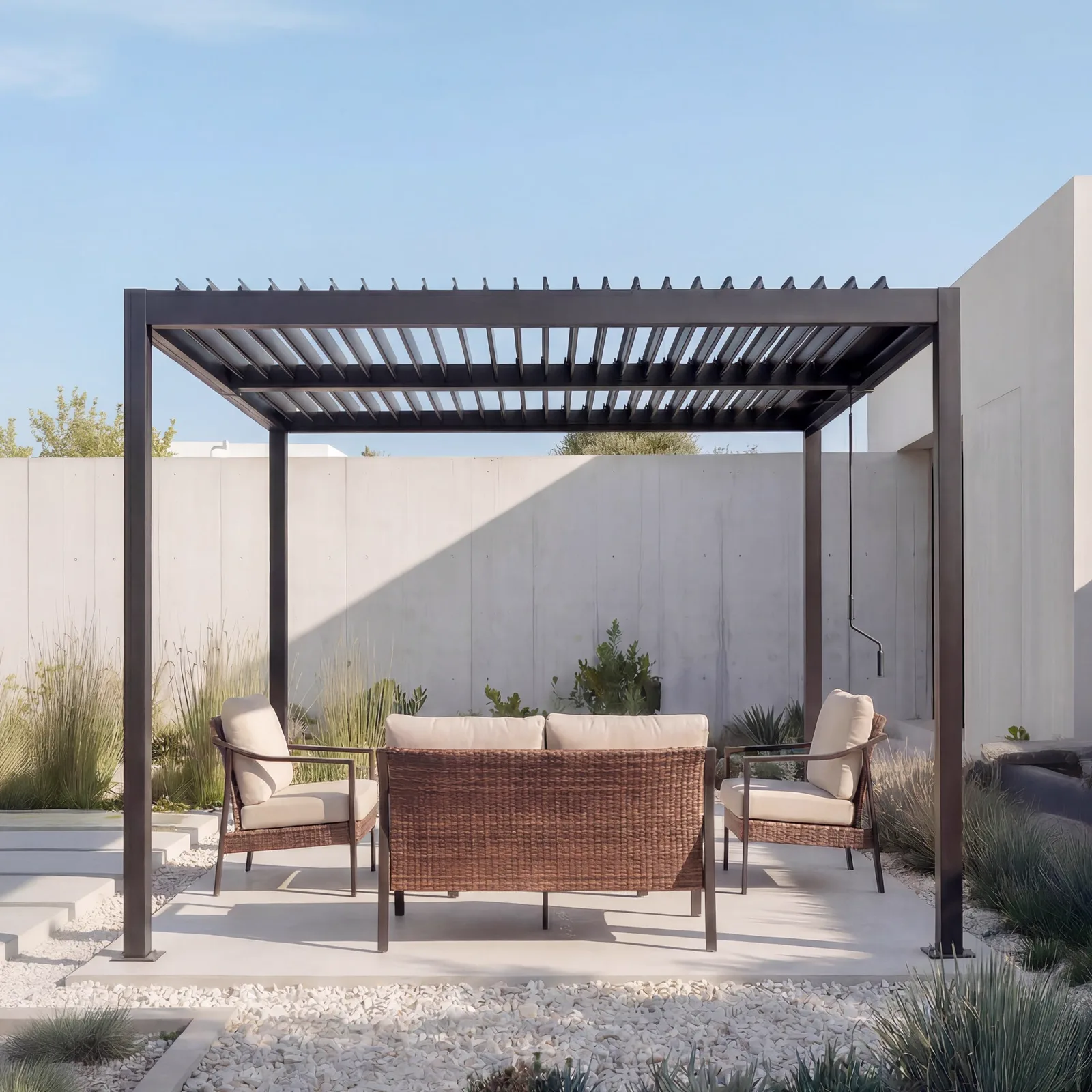 Complete outdoor package with pergola, sofa, lounge chairs and coordinated landscape setting