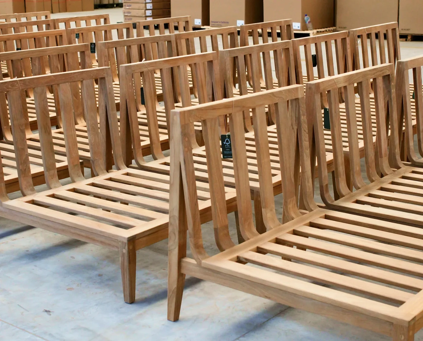 FSC-certified teak sofa frames awaiting cushions in the factory