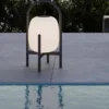 Outdoor Portable Lamp — Black 05, shown in a styled outdoor setting