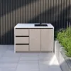 Outdoor Sink Cabinet — Gray 02, shown in a styled outdoor setting
