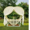 Canopy Daybed — Beige 01, shown in a styled outdoor setting