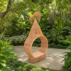 Hanging Egg Chair — Natural 01, shown in a styled outdoor setting