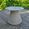 Outdoor Dining Table — Gray 01, shown in a styled outdoor setting